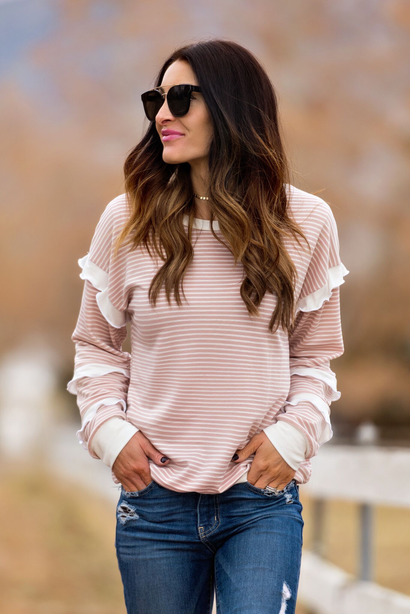 Woman in Blush Striped Ruffle Sleeve Sweatshirt