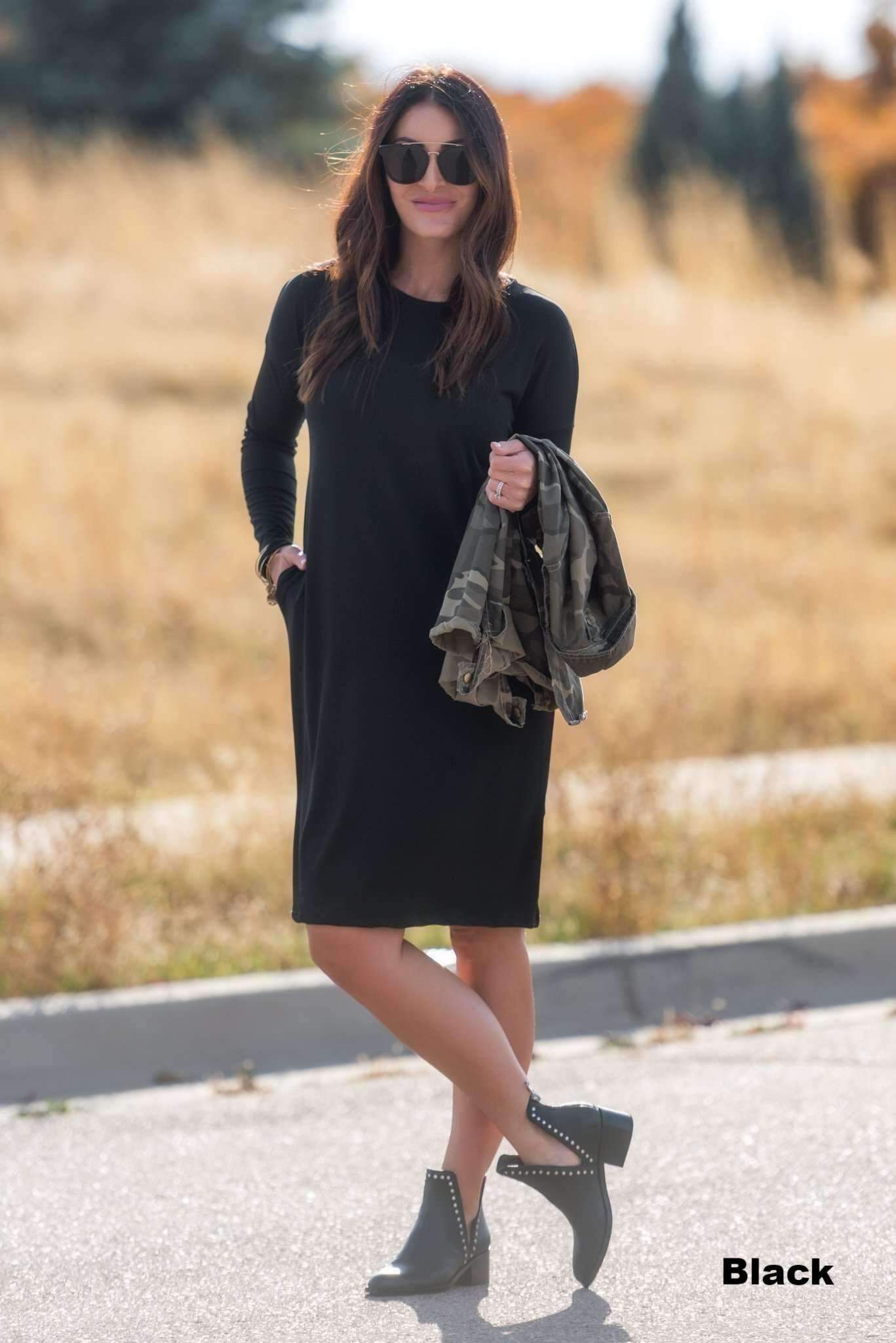 Woman wearing The Relax Dress in Black