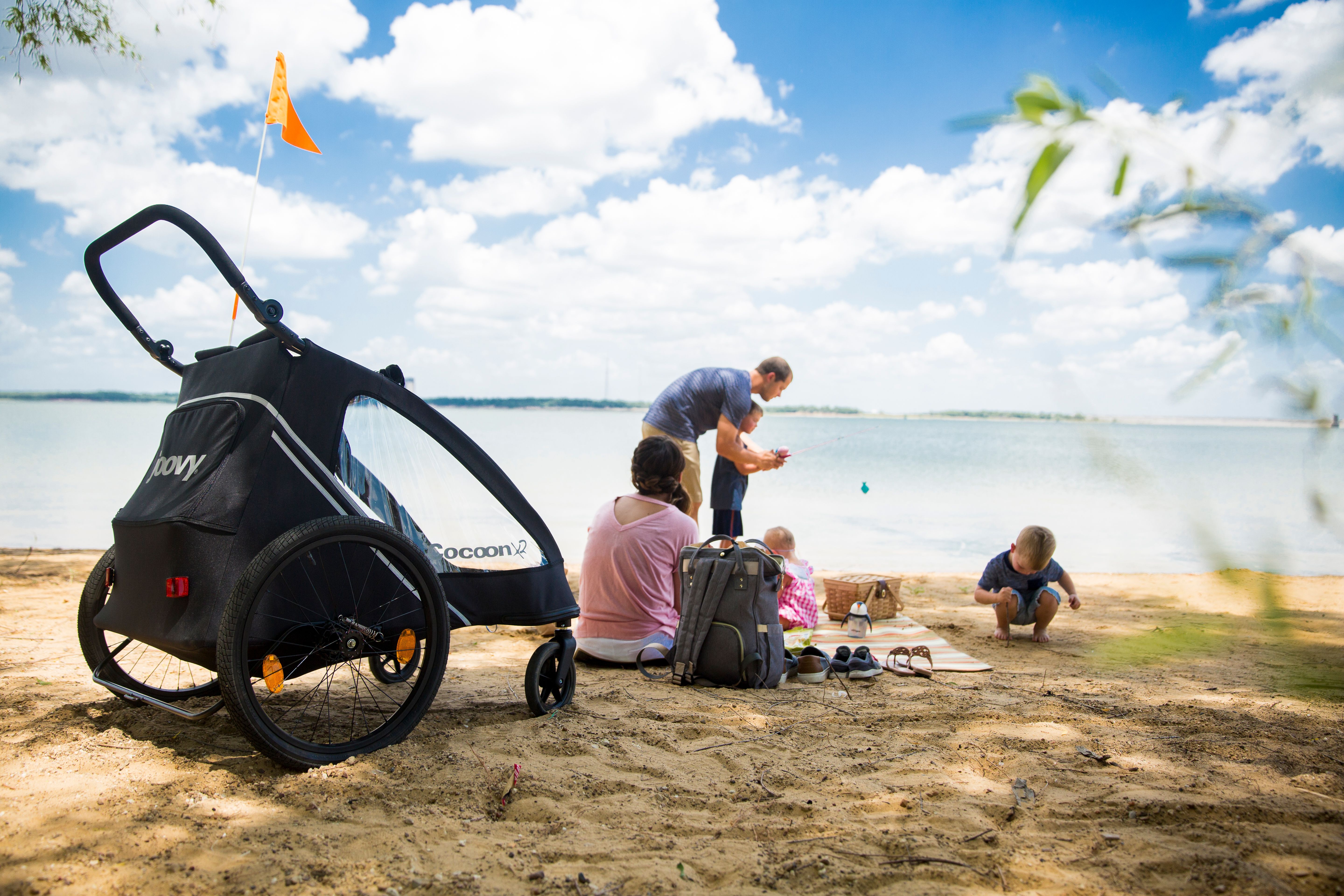 Family on the beach fishing and enjoying a picnic