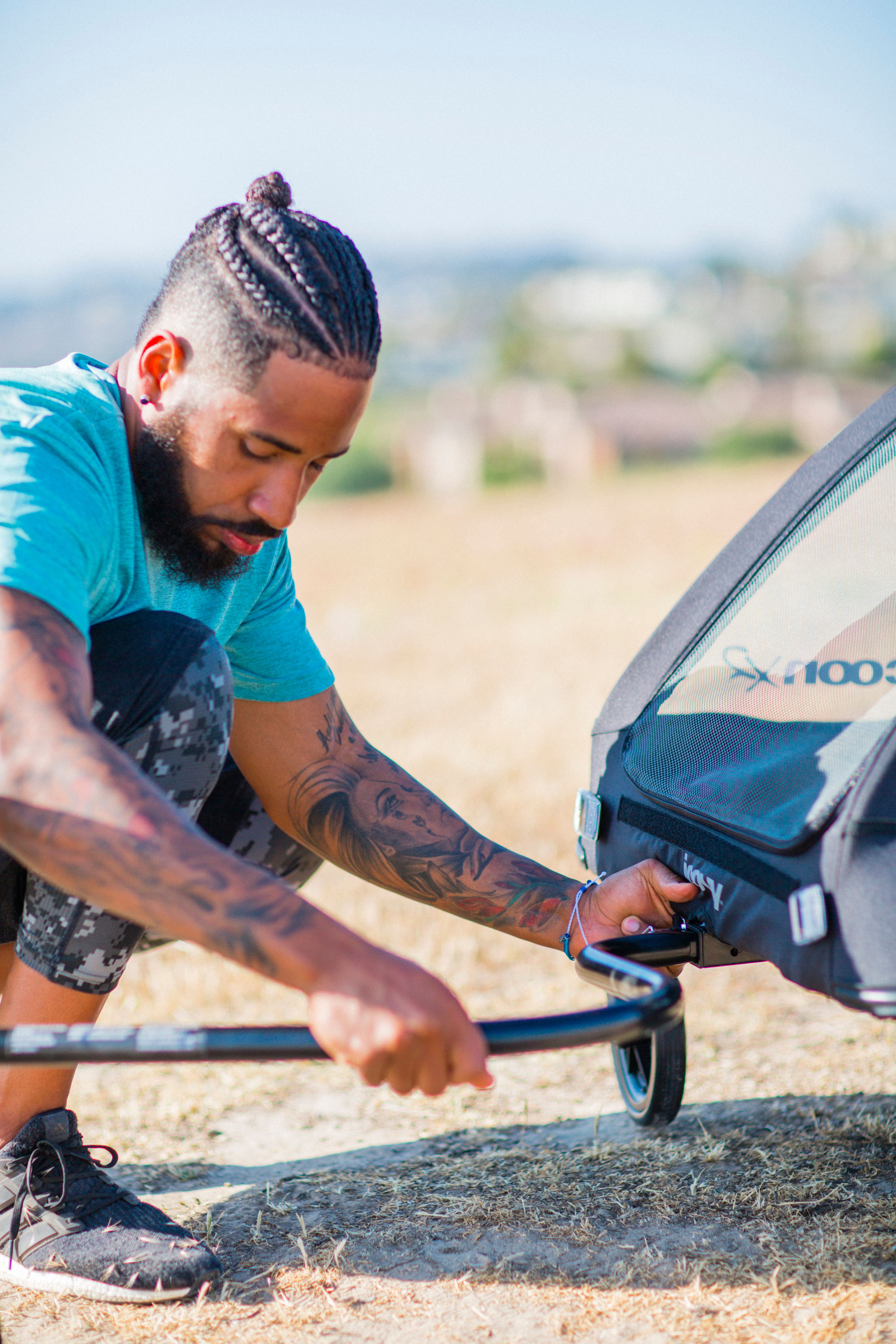 Man attaching bike tow arm to CocoonX2