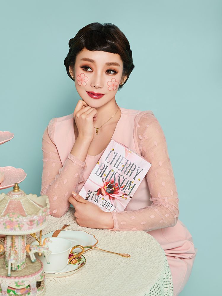 A model with Cherry Blossom Flower Mask applied to her face